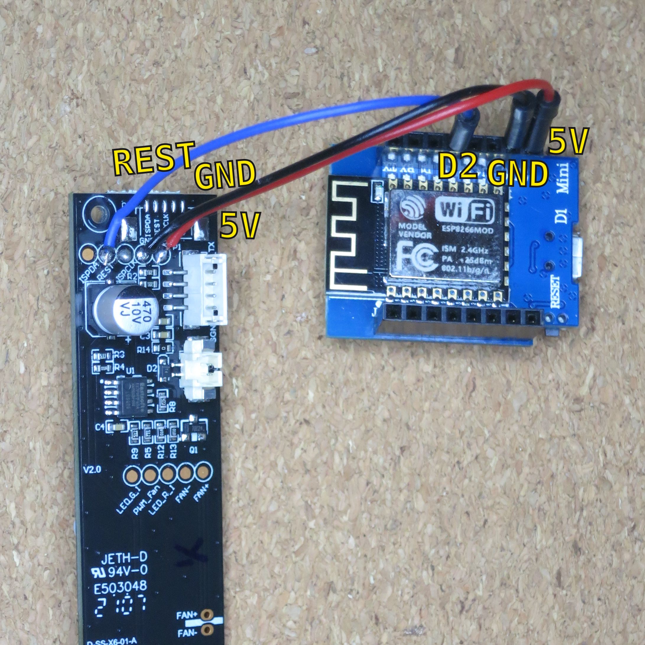 The VINDRIKTNING main board and a ESP8266 breakout board, connected with three wires.