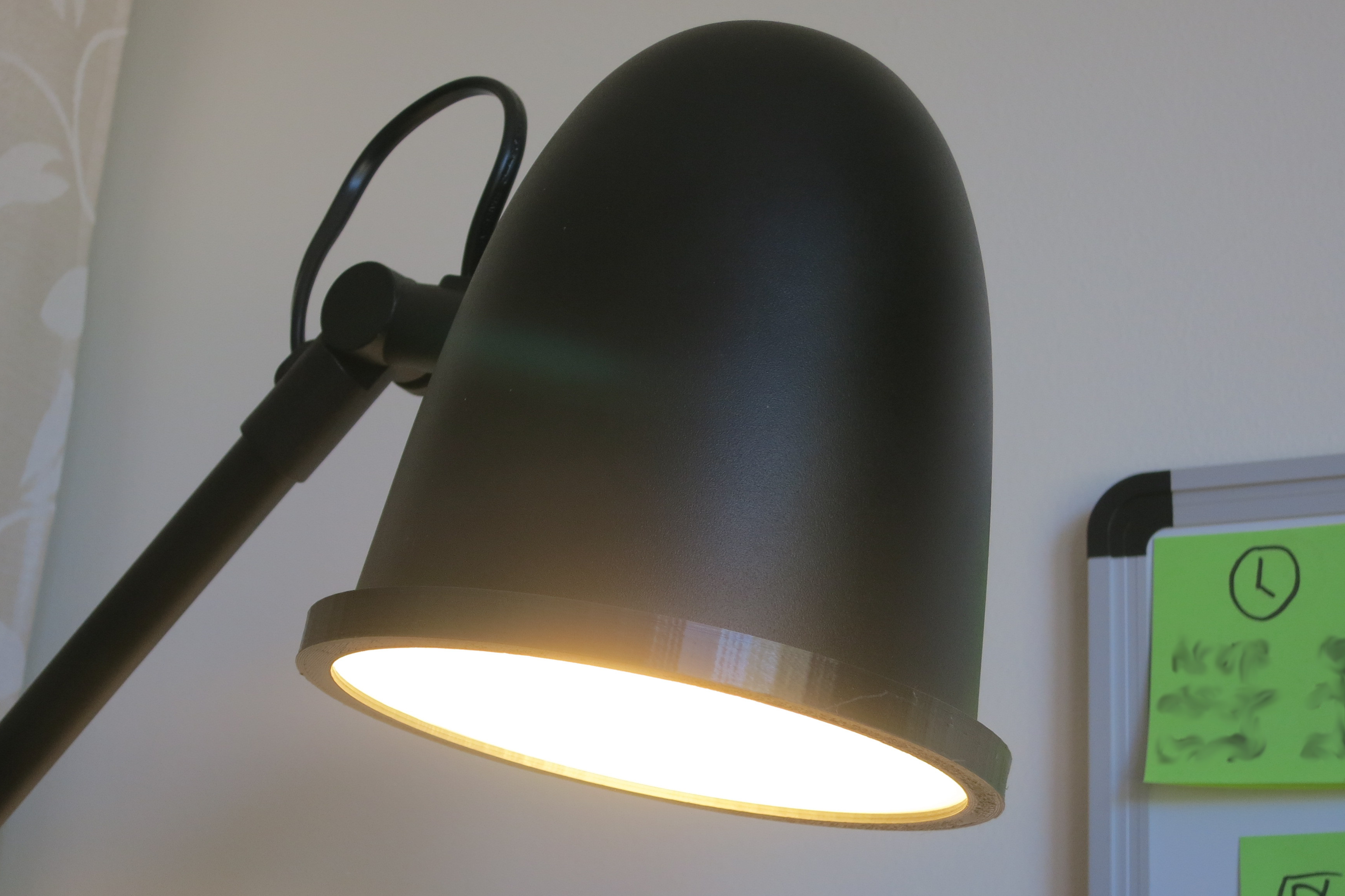 A SKURUP lamp, donor HEMMA cord set, and Sengled LED bulb laid out on a table