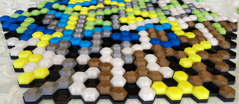 A finished six-player game of Gem Hero. The tray is almost fully populated with gem tiles.