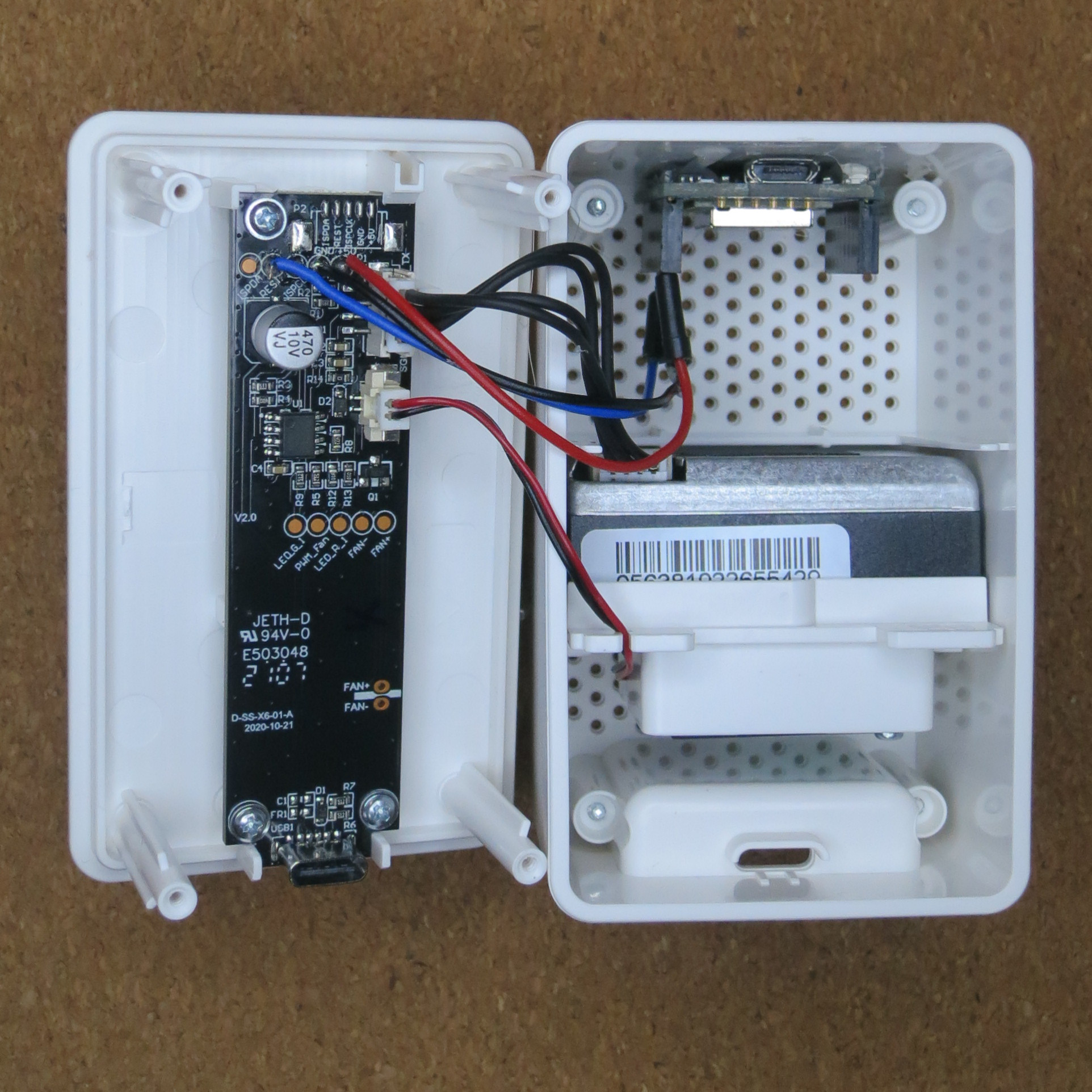 Two sections of the VINDRIKTNING housinng. The main board is hosted in the front side, the ESP8266 breakout board is mounted in the rear side.